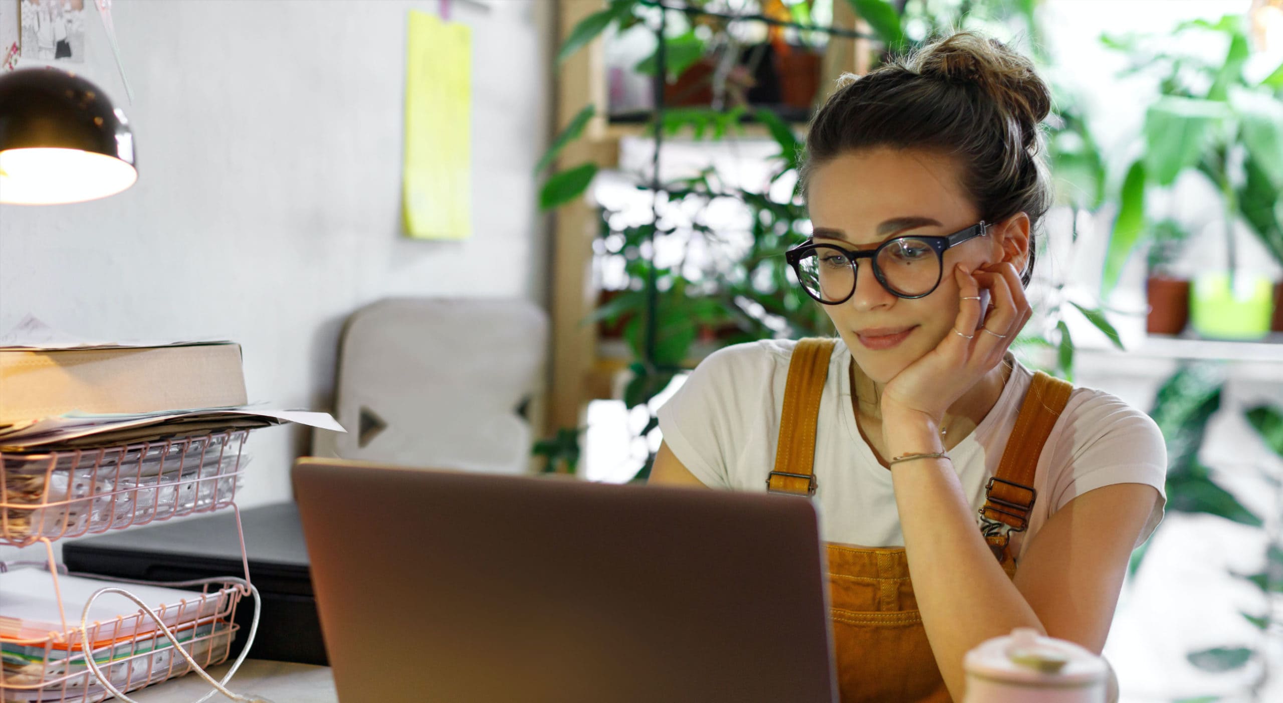 Photo of a woman in front of a laptop
