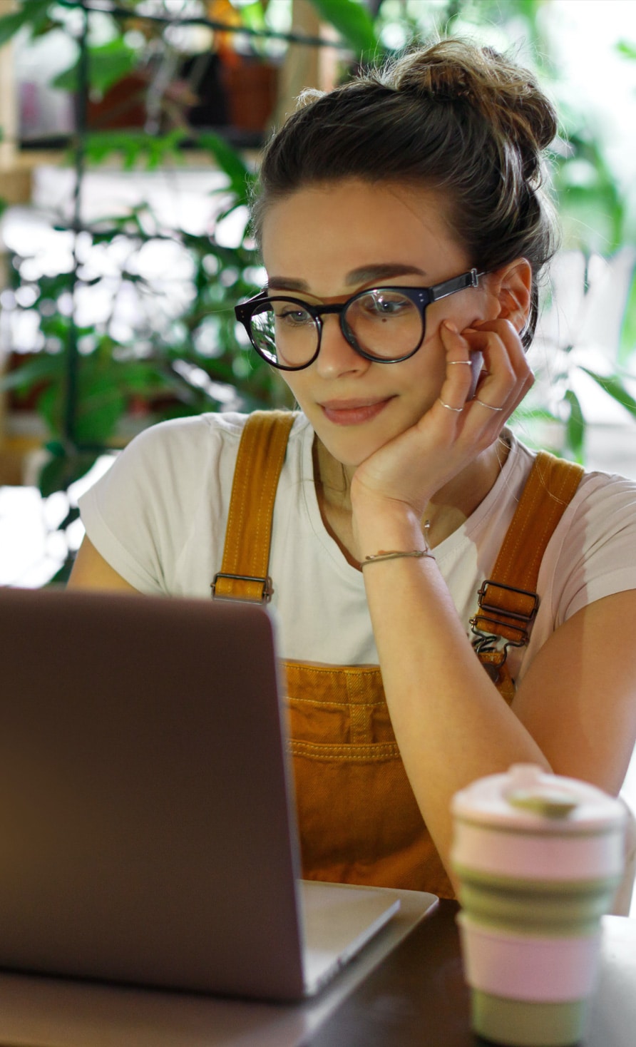 Photo of a woman in front of a laptop